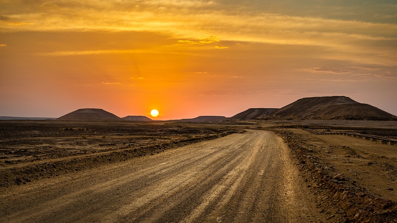 Dusty sand road sunset in Yemen desert
