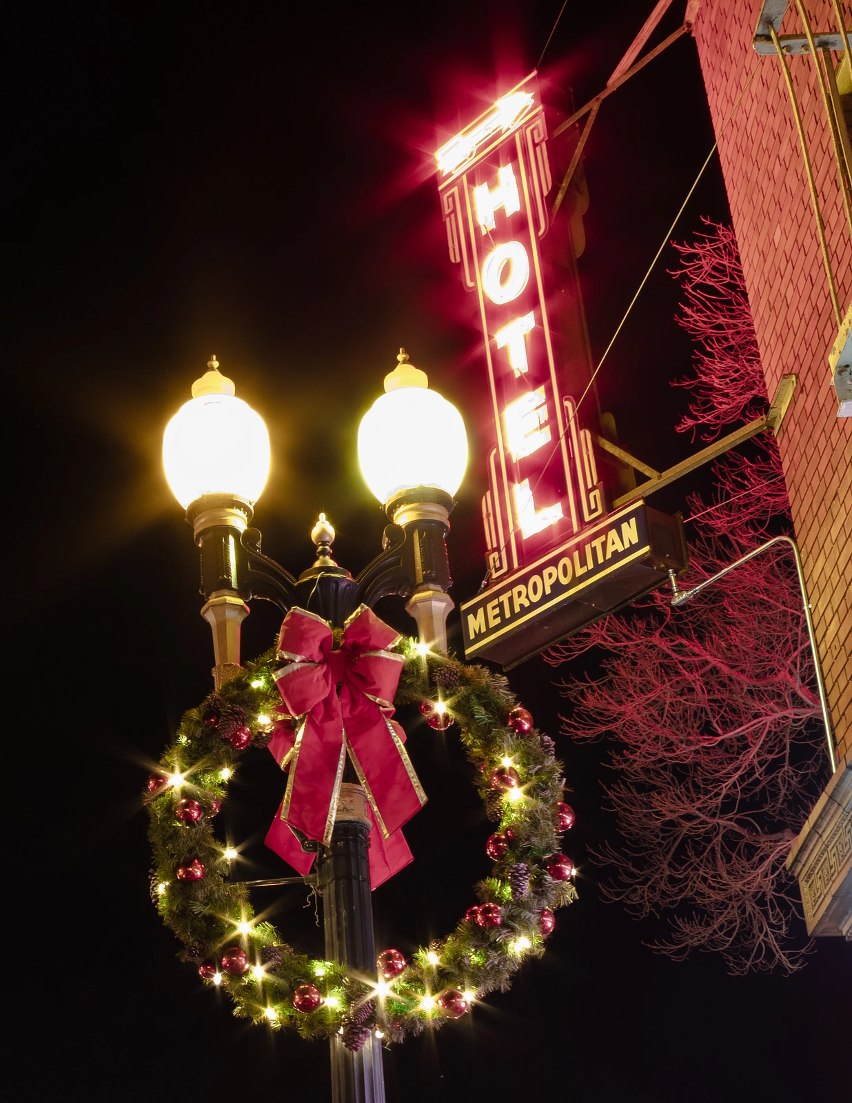 Neon sign and street lamp with Christmas decoration