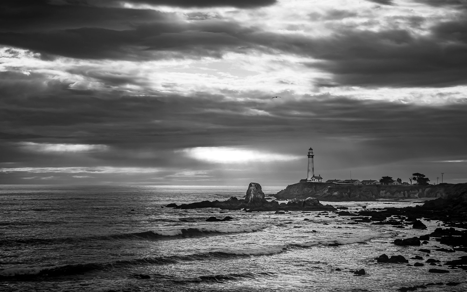Moody lighthouse. Ocean, clouds and light