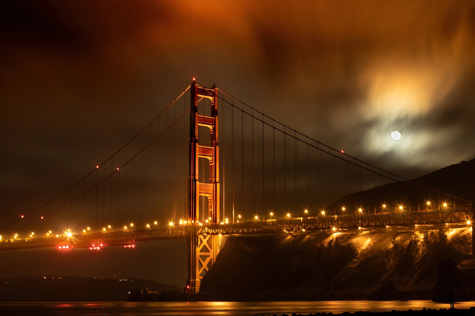 Golden Gate Bridge, fog and full moon 2. Moon setting at 4am.
