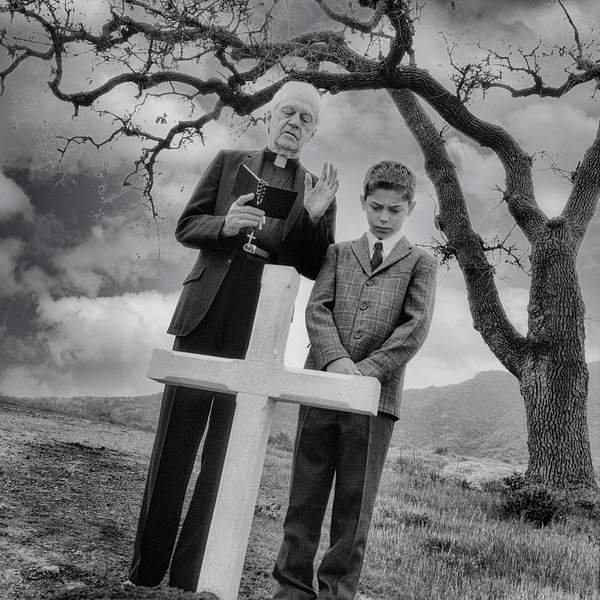 Priest with young boy at Funeral- by KenChernus