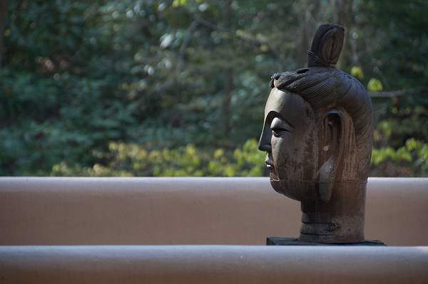 Statuary head on living room deck by Willis Chung