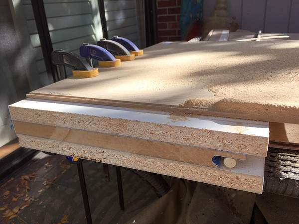 Snugging a dowel into the curved top edge of the drawer...