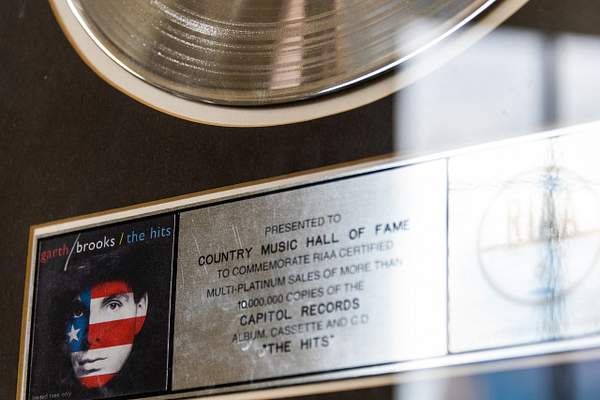 A Garth Brooks platinum hit record, 'The Hits.' by...