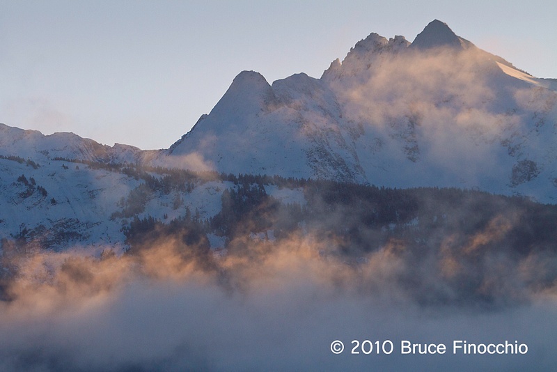Early Morning Light Touches Fog As It Ghost Over Inside Passage Mountains